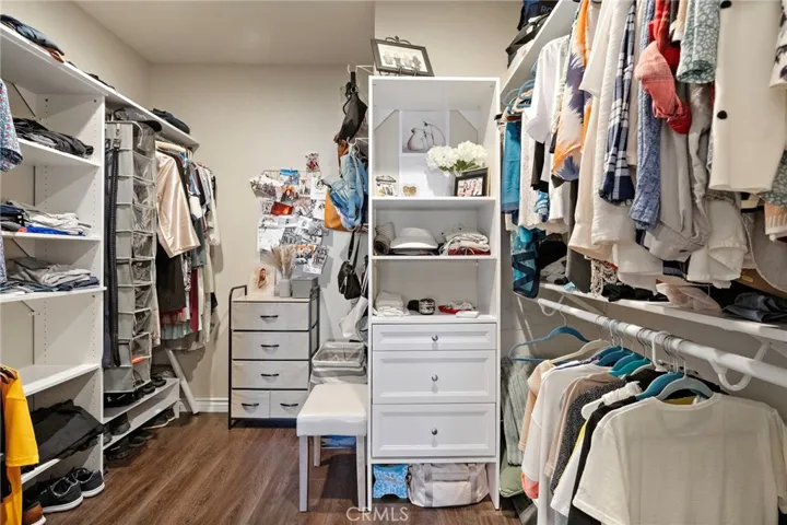 A very LARGE and VERY CUSTOM closet in the Primary Suite
