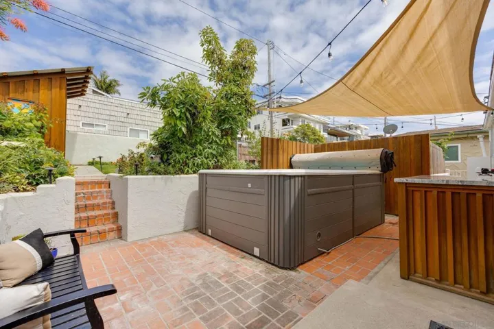 Cute patio and grassy areas above.