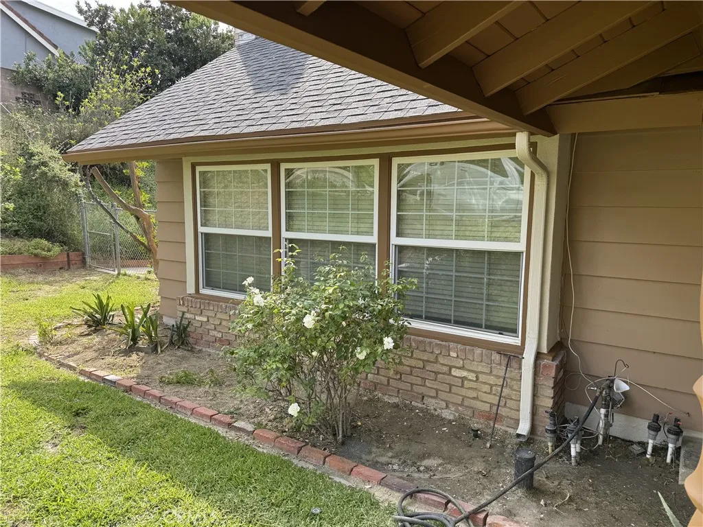 LEFT OF FRONT DOOR
