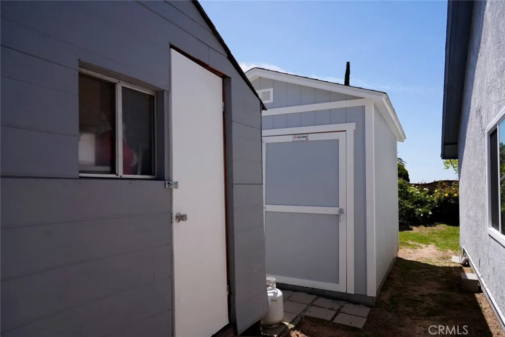 Two sheds located on the side yard
