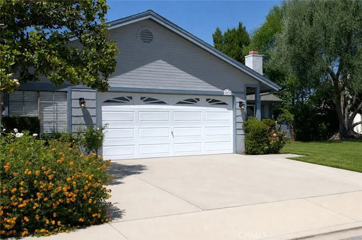 Digitally enhanced, sod at right of driveway