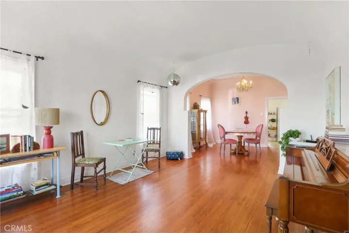 Charming textured walls, dome ceiling and archway to formal dining room