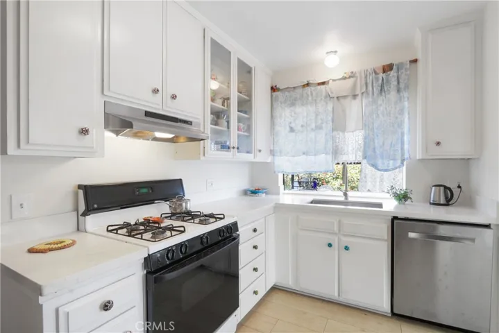 Sunny and bright kitchen window faces east for the sunrise!