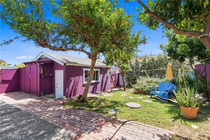 Spacious rear yard, single garage used as art studio!