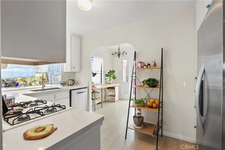 Uppraded kitchen with new flooring, new quartz counters and stainless steel sink, PLUS a breakfast nook!!