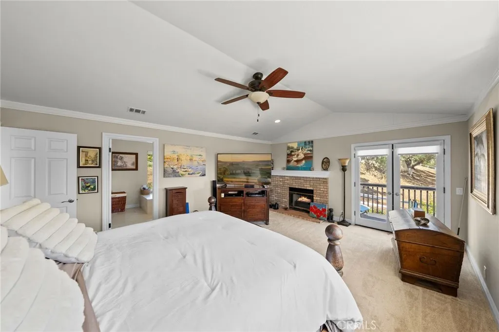 Primary Bedroom with Fireplace & Balcony