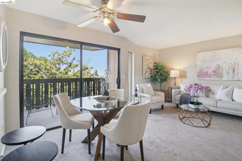 Dining room with carpet flooring and a ceiling fan