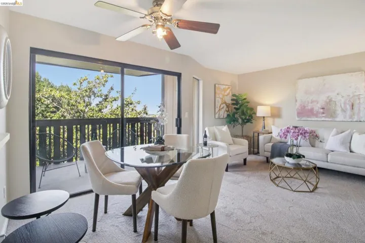 Dining room with carpet flooring and a ceiling fan