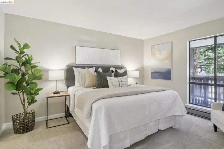 Bedroom with light colored carpet