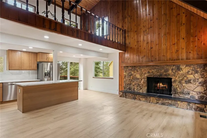 Main living area with fireplace, kitchen, dining combined