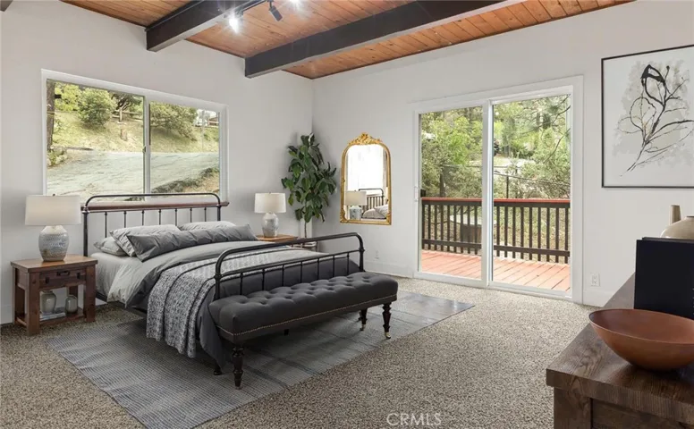 Primary bedroom tucked away right off the living room (Virtually staged)