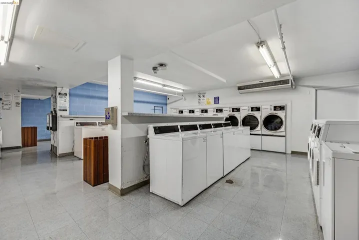 Community laundry featuring washer and clothes dryer