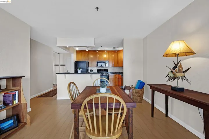 Dining room featuring light wood-style floors and baseboards