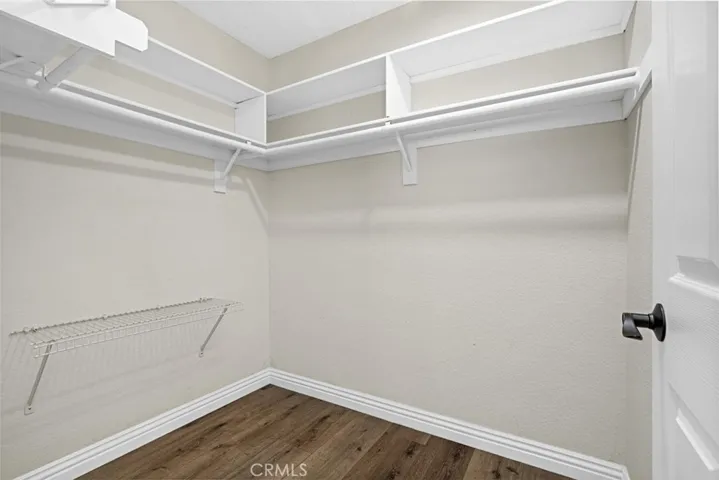 walk in closet in primary bedroom
