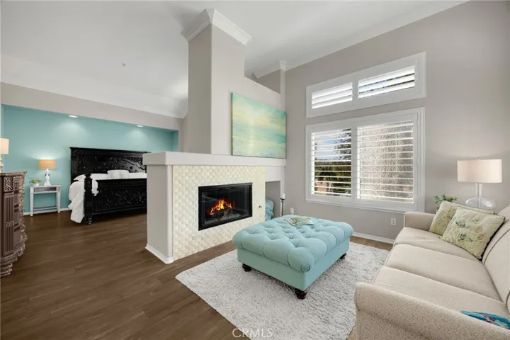 Spacious primary suite featuring a dual-sided fireplace, retreat area, and warm natural light-your own private coastal sanctuary 

Spacious primary suite featuring a dual-sided fireplace, retreat area, and warm natural light -your own private coastal sanctuary