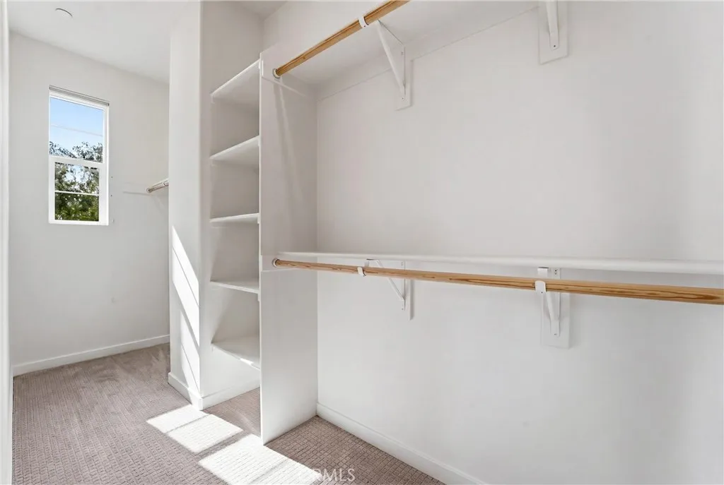 Spacious walk in closet in the primary