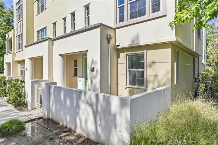 End unit with a front patio area. Shares only one wall