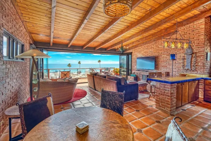 Open Floor includes living area, dining area, kitchen and vanishing wall access to the ocean view terrace.