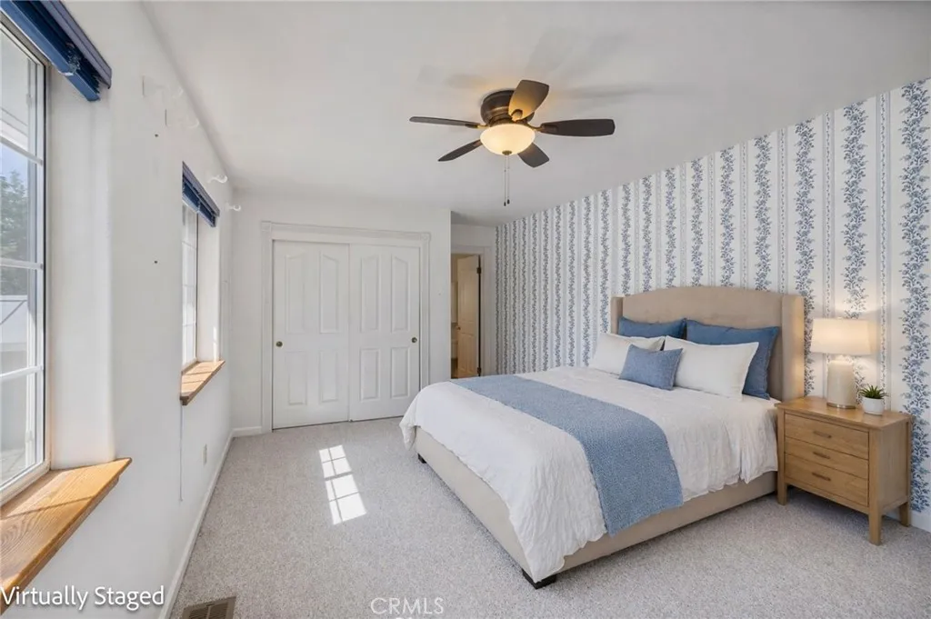 Downstairs primary suite virtually staged
