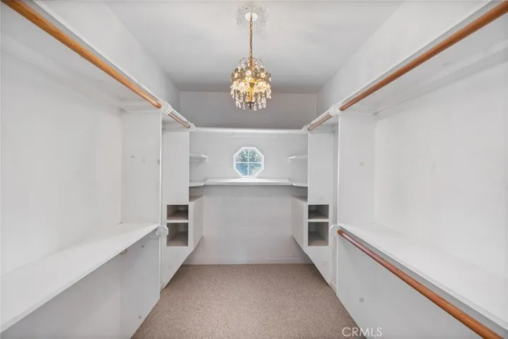 Upstairs primary suite walk in closet