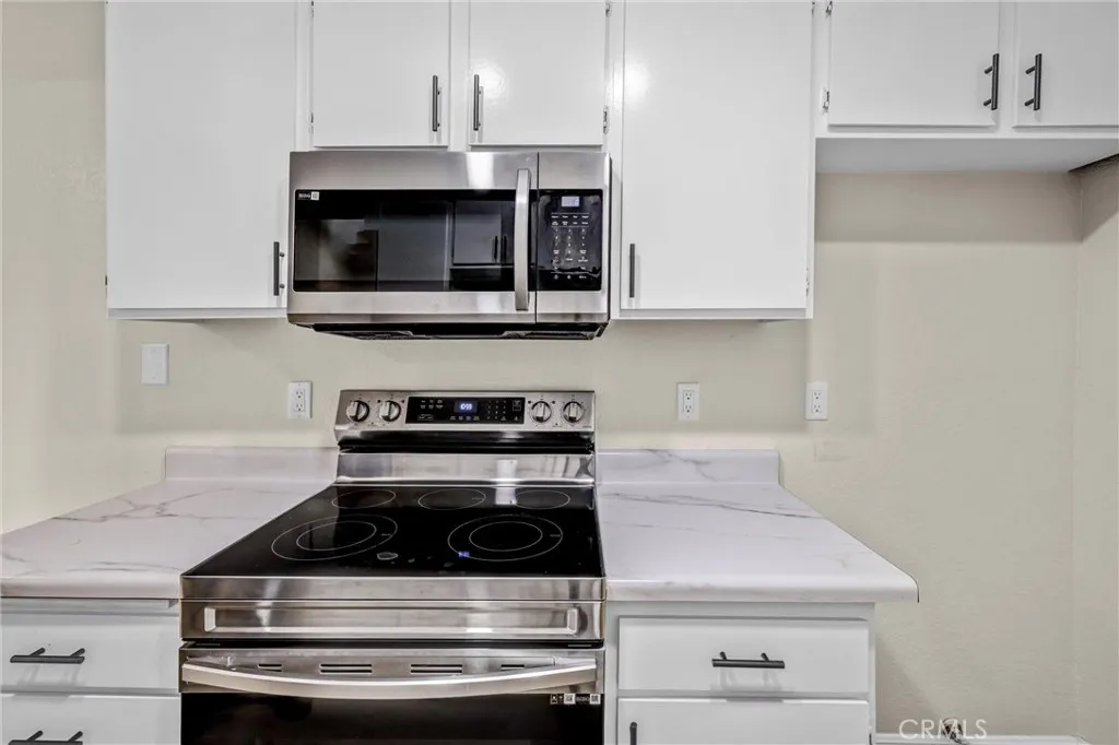 Stainless steel appliances compliment the kitchen.