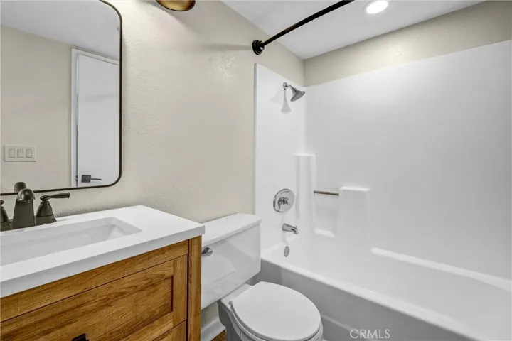 The primary bath has a tub in shower.