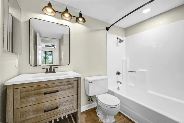 The guest bathroom is accessible from the hallway as well as bedroom #2.