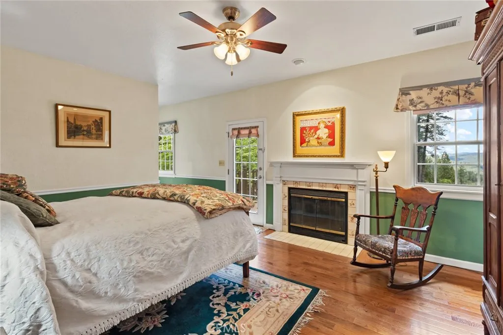 Primary suite with fireplace and balcony.