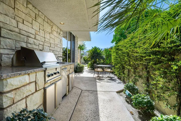 Shaded side yard with gas BBQ