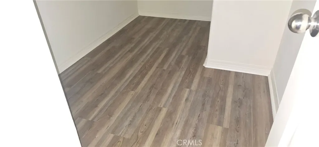 New laminate flooring in walkin closet. Primary bedroom