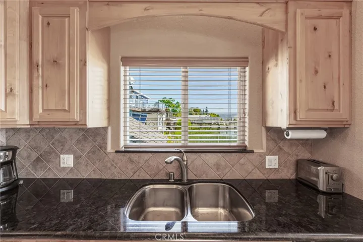 Stainless Steel sinks and granite counter tops.