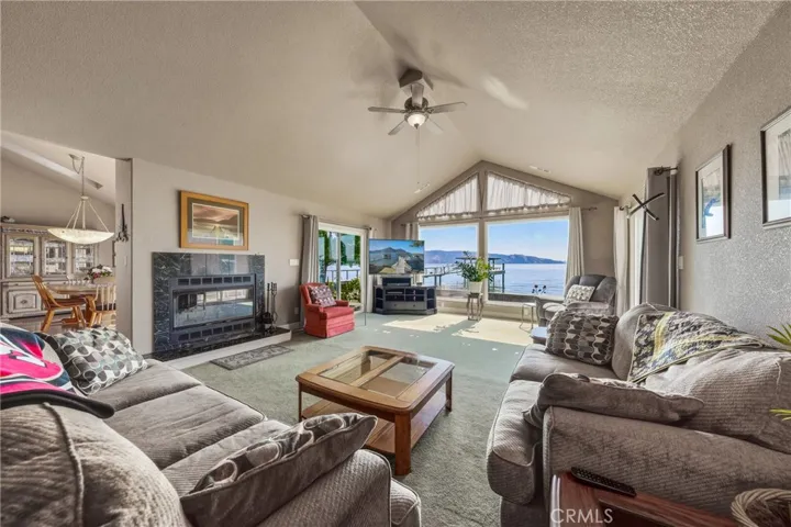 Living Room with Fireplace and the beautiful View of the Lake