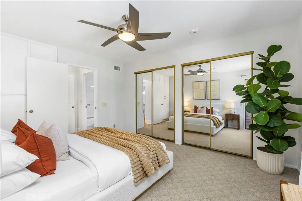 2nd Primary En-suite w/Mirrored Wardrobe Closets + an additional Closet behind the entry door