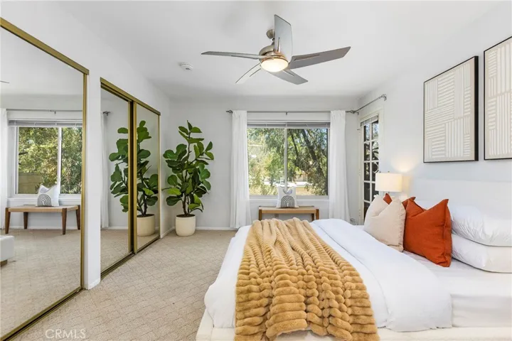 2nd Primary En-suite w/Mirrored Wardrobe Closets + an additional Closet behind the entry door