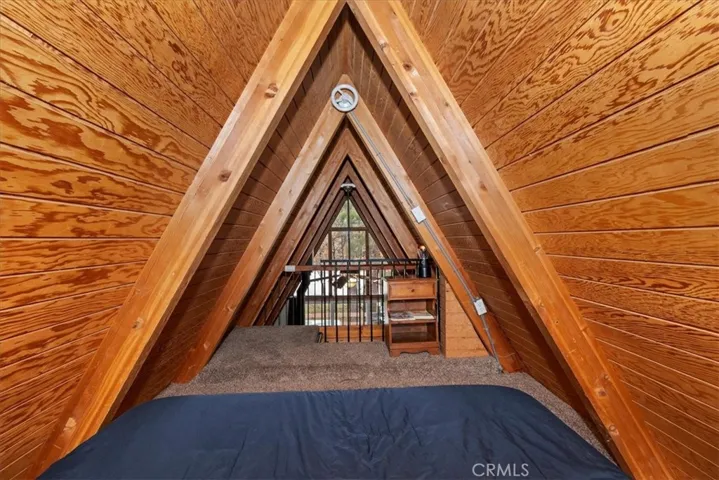 Loft with window looking toward back of Cabin