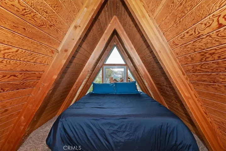 Loft with window looking toward front of Cabin.