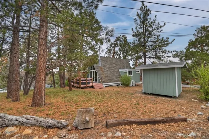 View of Rear Deck, Cabin, and storage shed.
