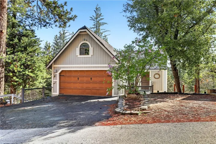 Front elevation- level entry with 2 car garage and 3 extra parking spots