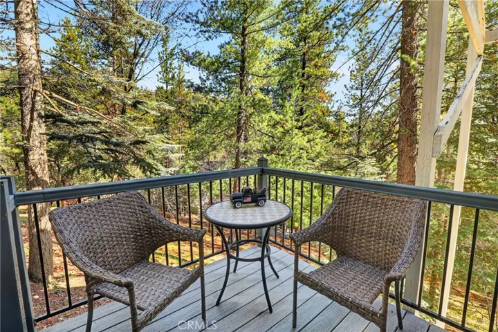 Deck area off of game room overlooking wooded area