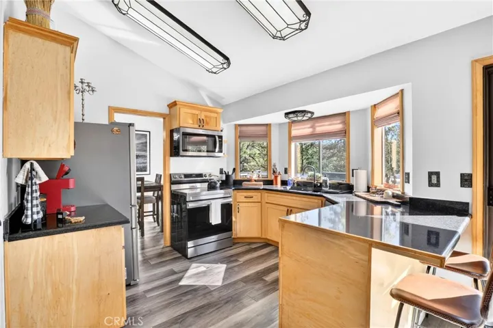 Breakfast bar in kitchen with walk-in pantry