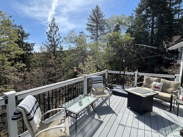 Trex decking across the back of the home off main floor overlooking wooded area
