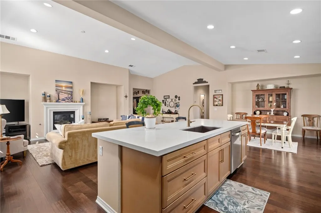 Remodeled kitchen island open to living/dining area