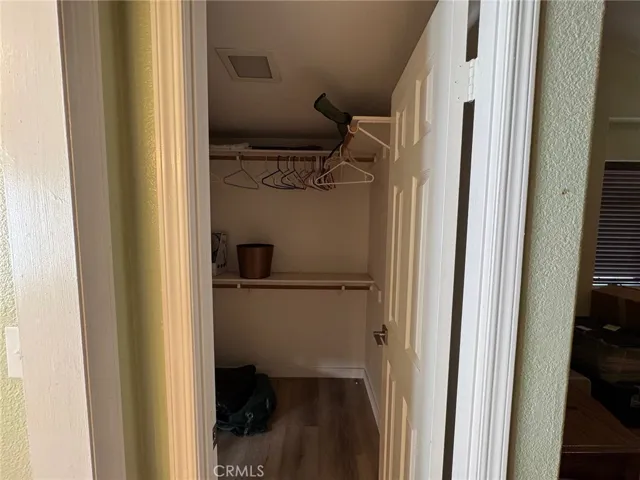 Walk-in closet in the primary bedroom.