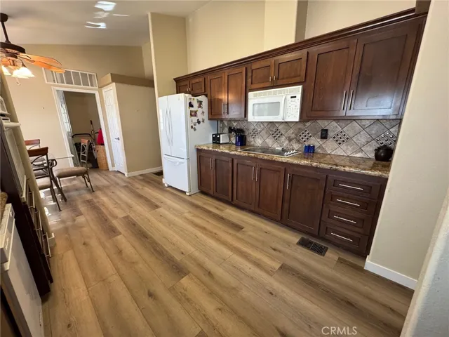 This really shows the square footage in the kitchen looking towards the walk-in pantry and laundry room at the end.