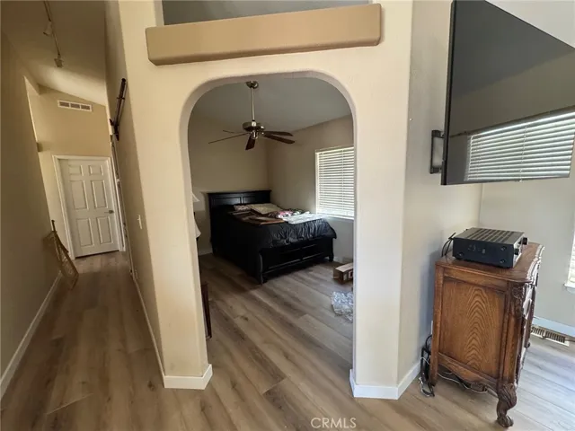This can be an office, wine tasing/ game table room or bedroom. You could even close this archway and put a bedroom door in the hallway if that is more what you need.