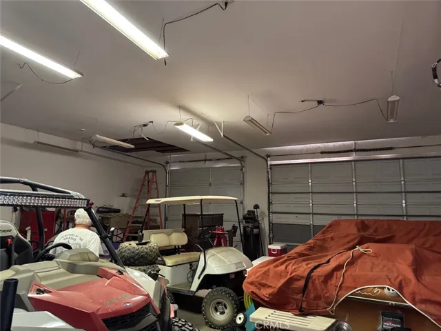Dry wall garage with high doors and room for everything.