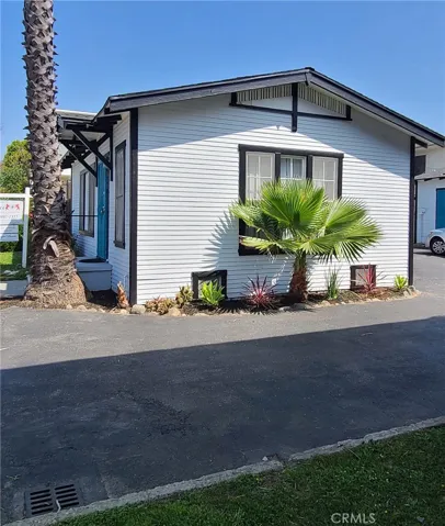 Side of home along driveway entry