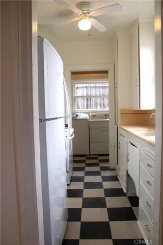 Kitchen, adjacent to laundry area