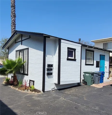 Back of home with one parking space