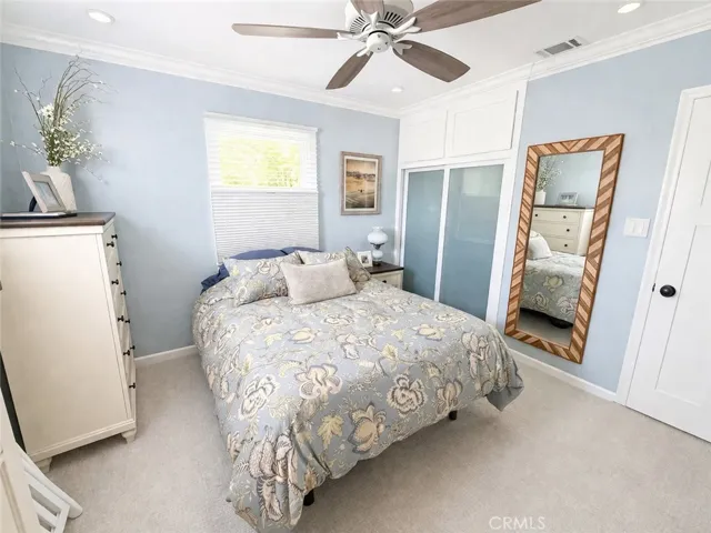 Guest bedroom with custom closet organizer